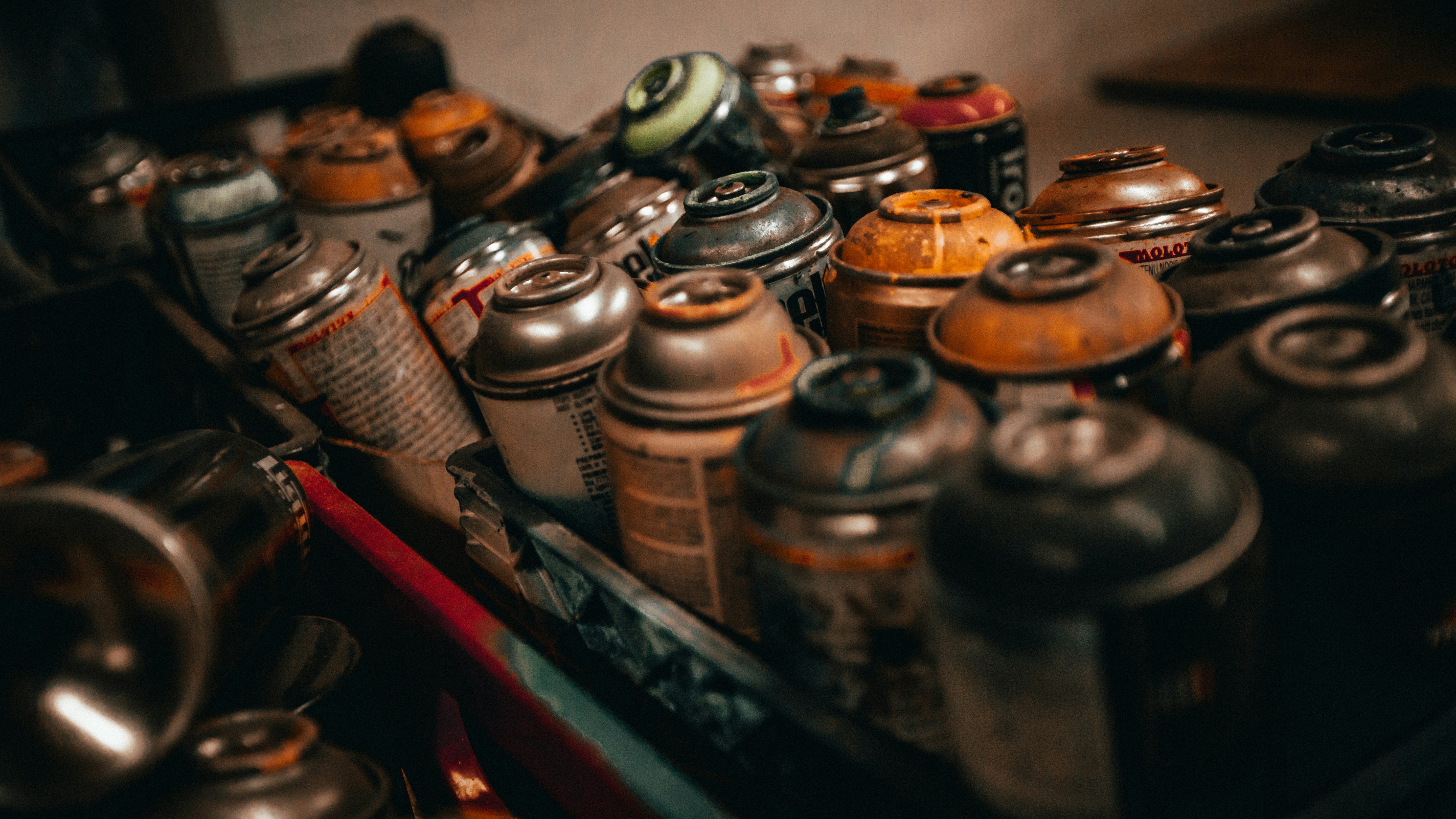 assorted glass jars on black shelf
