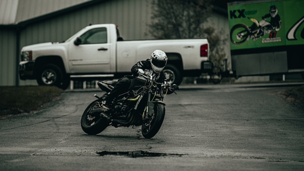 black and white motorcycle on road during daytime