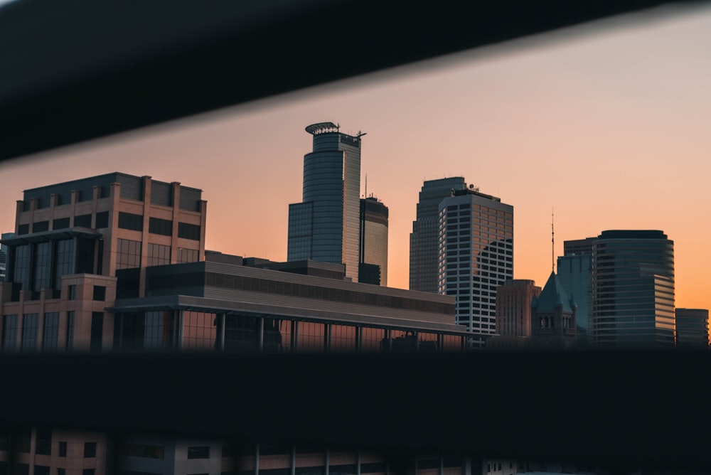 silhouette of city buildings during sunset