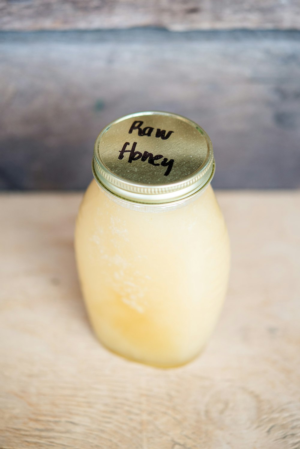 clear glass jar with yellow liquid