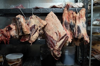 raw meat on black grill