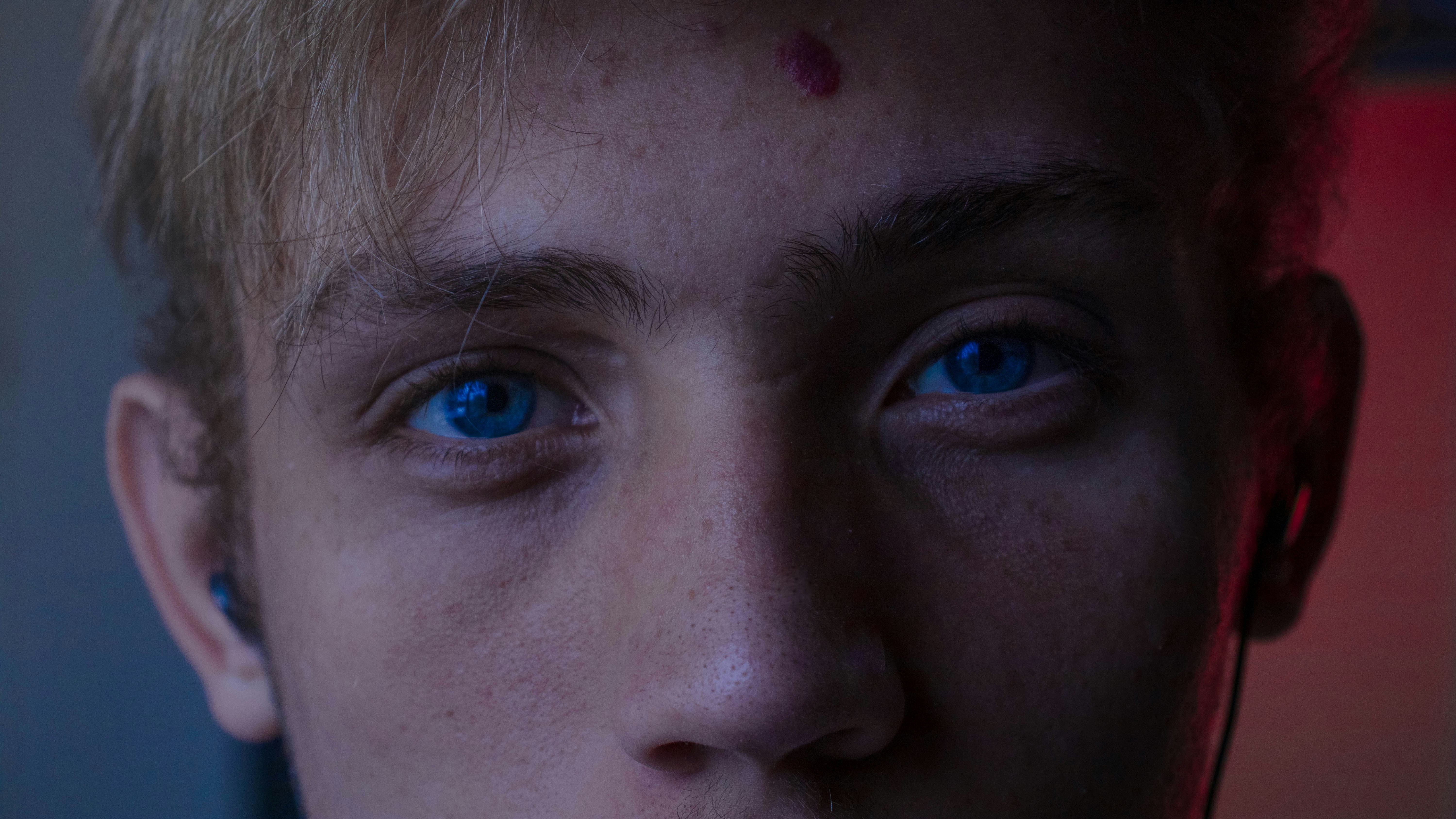 persons face with blue eyes