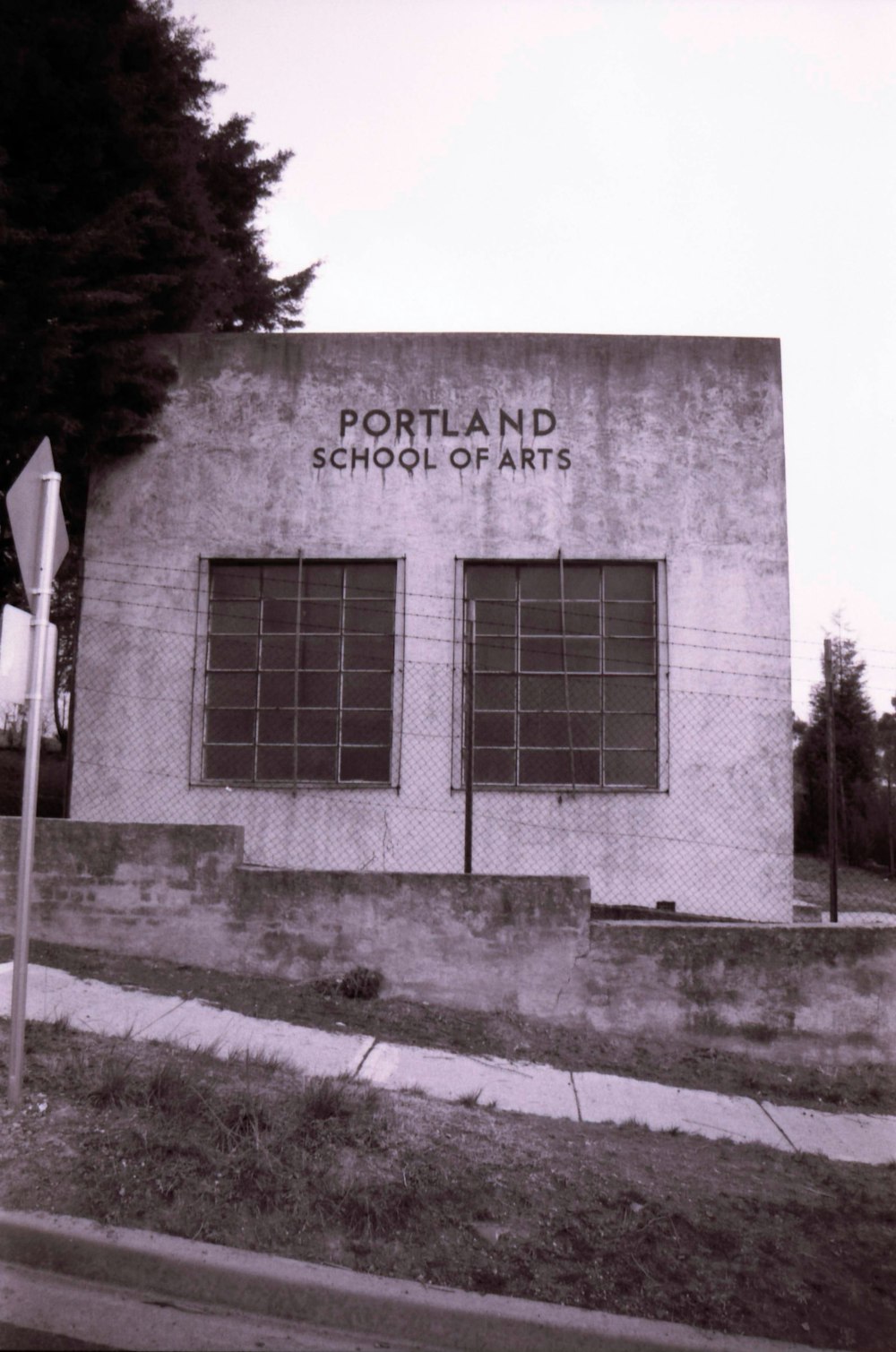 a black and white photo of a school building