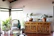 A cozy living room corner featuring a sturdy wooden cabinet with a soft brown finish.