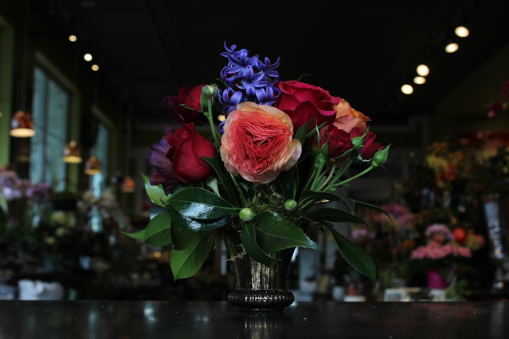 pink roses in clear glass vase