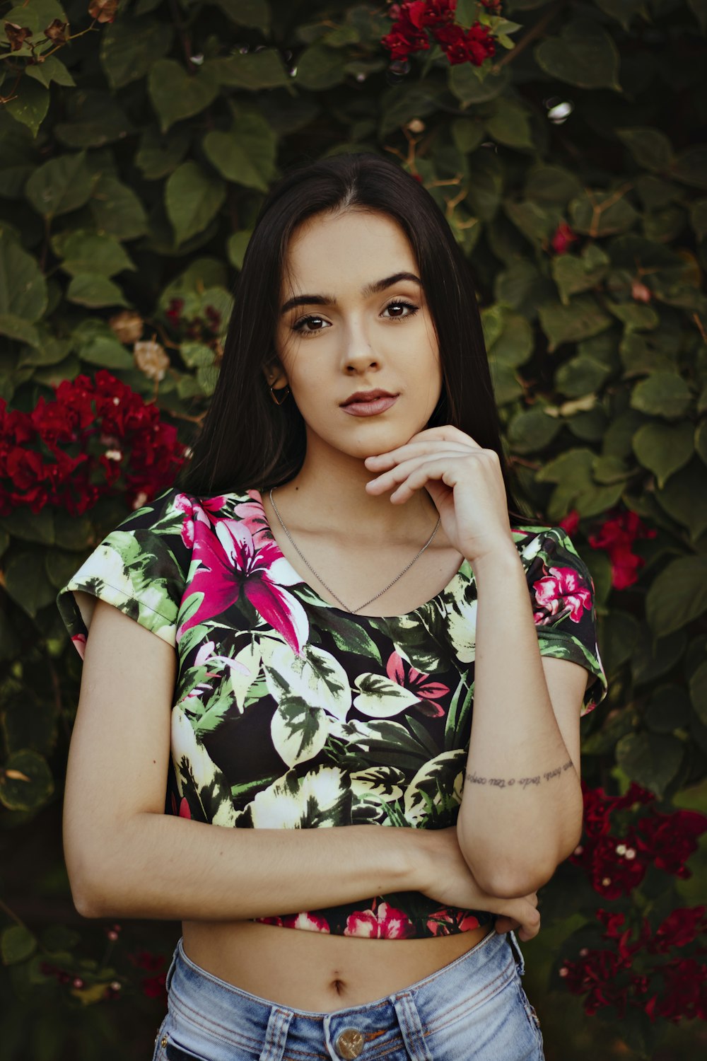 woman in black green and pink floral scoop neck shirt