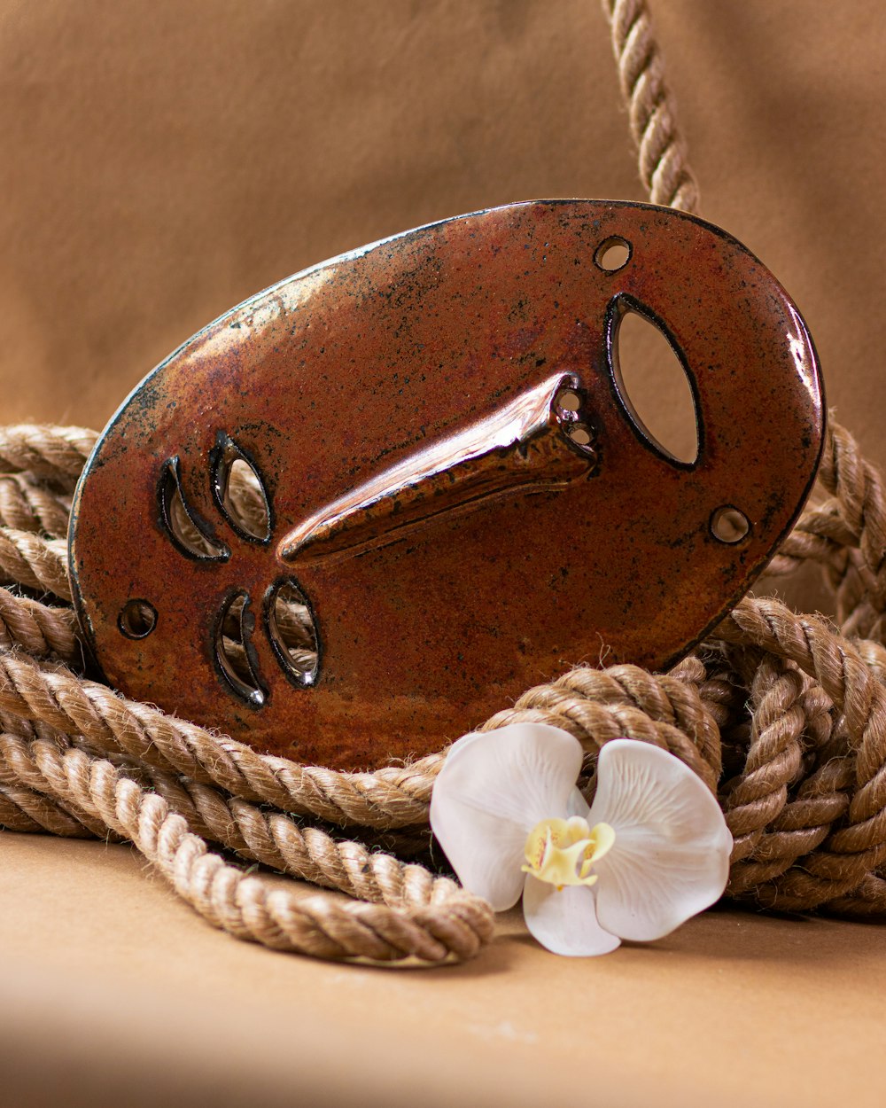 brown leather horse saddle on brown wooden table