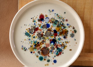 white ceramic bowl with assorted beads