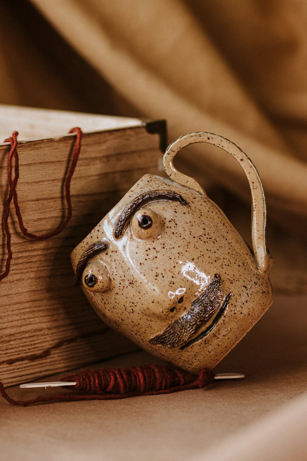 brown ceramic mug on brown wooden table