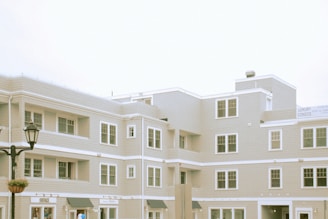 white concrete building under white sky during daytime