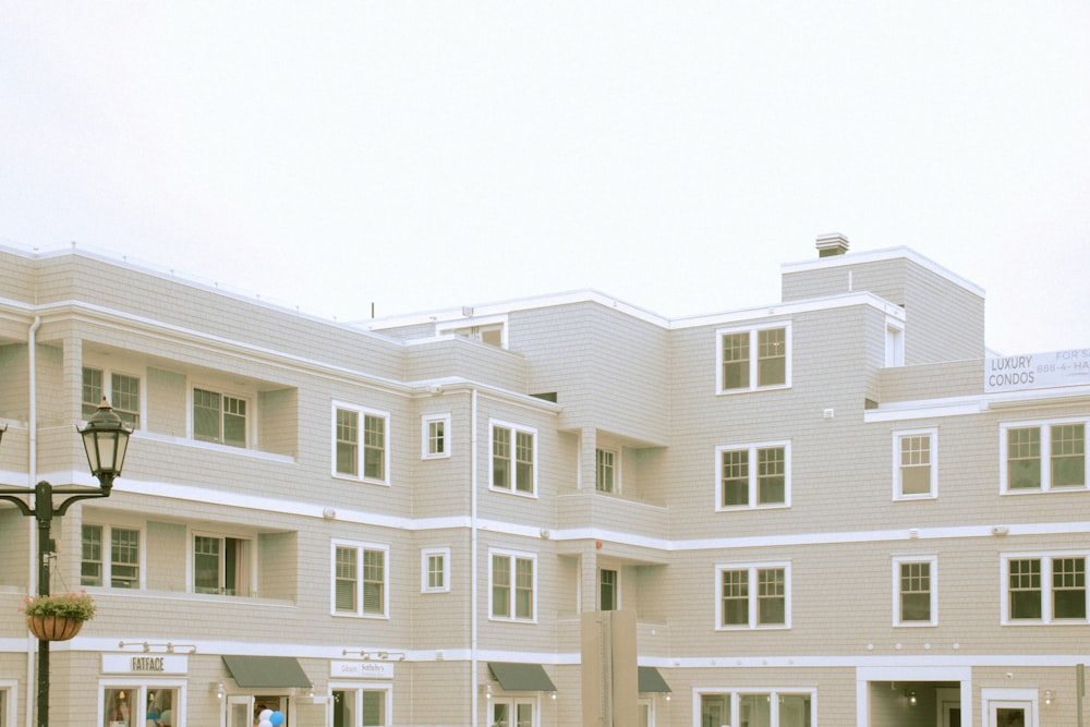 white concrete building under white sky during daytime