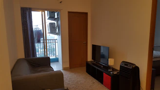 Comfortable living room cooled by a discreet air conditioning system.