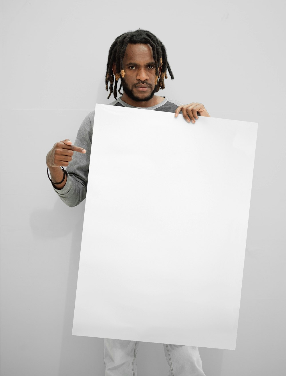 woman in white long sleeve shirt holding white printer paper