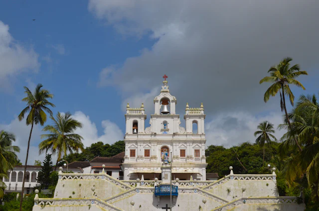 Panjim church framed by palm trees
