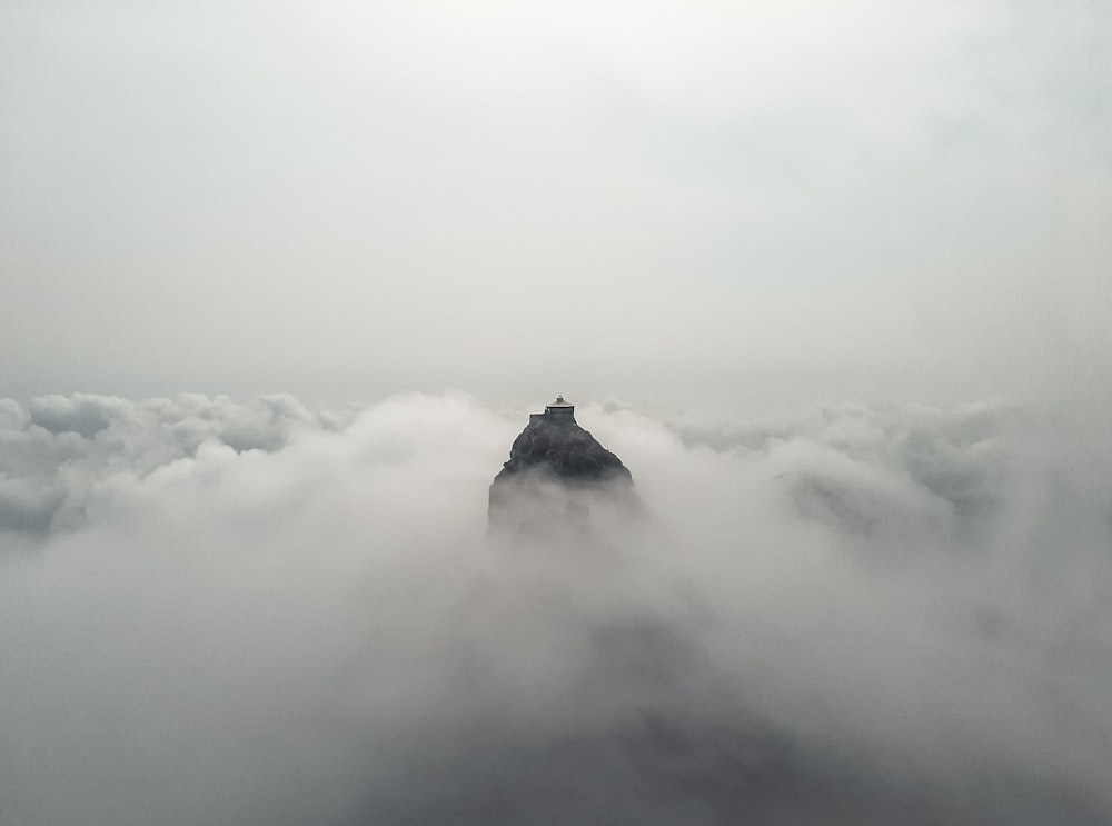 white clouds over mountain during daytime