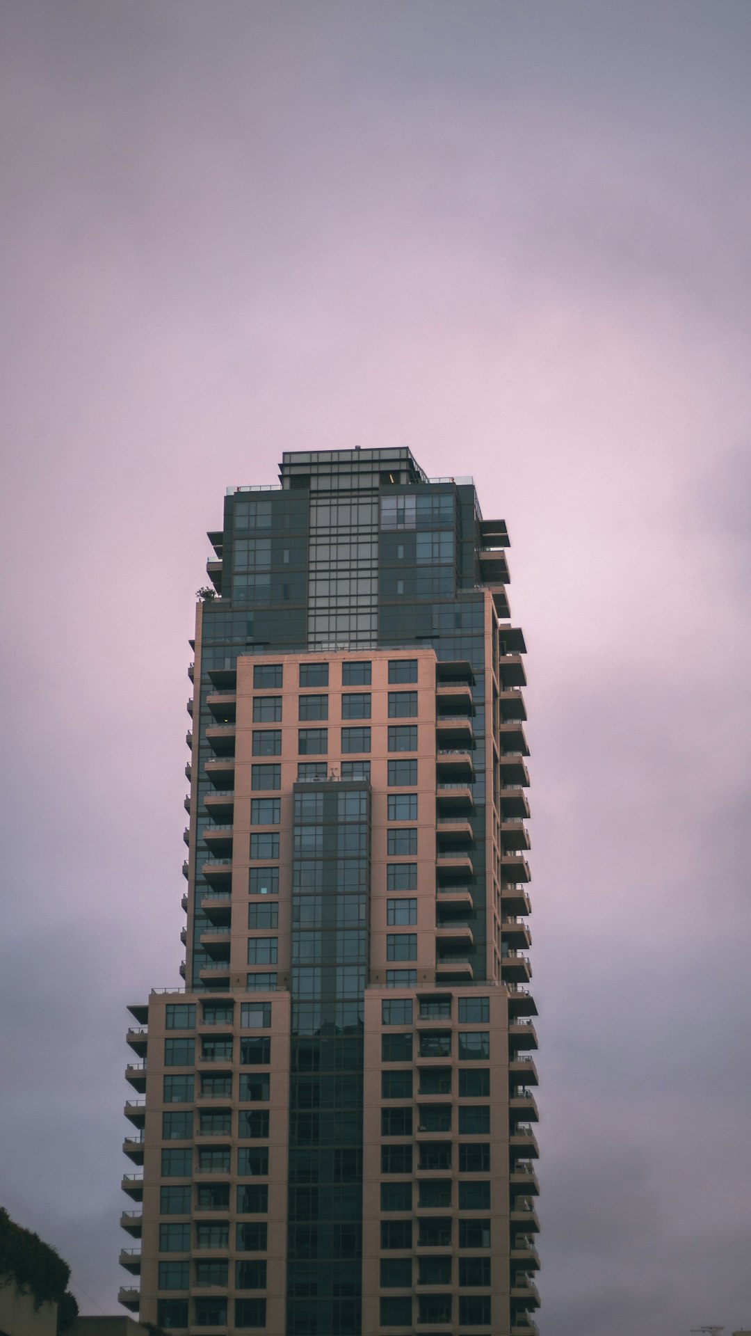 brown concrete building under gray sky