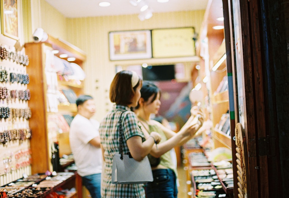 man and woman standing in front of store