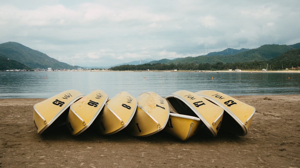 white and yellow boat on sea during daytime