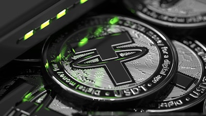 a close up of a pile of crypto coins