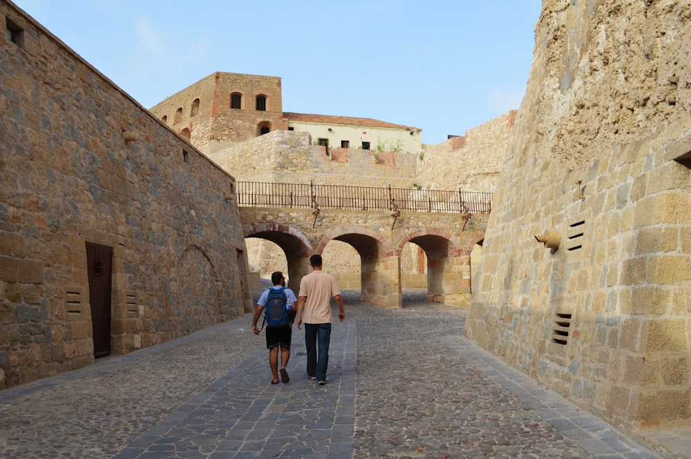 people walking on gray concrete pathway during daytime