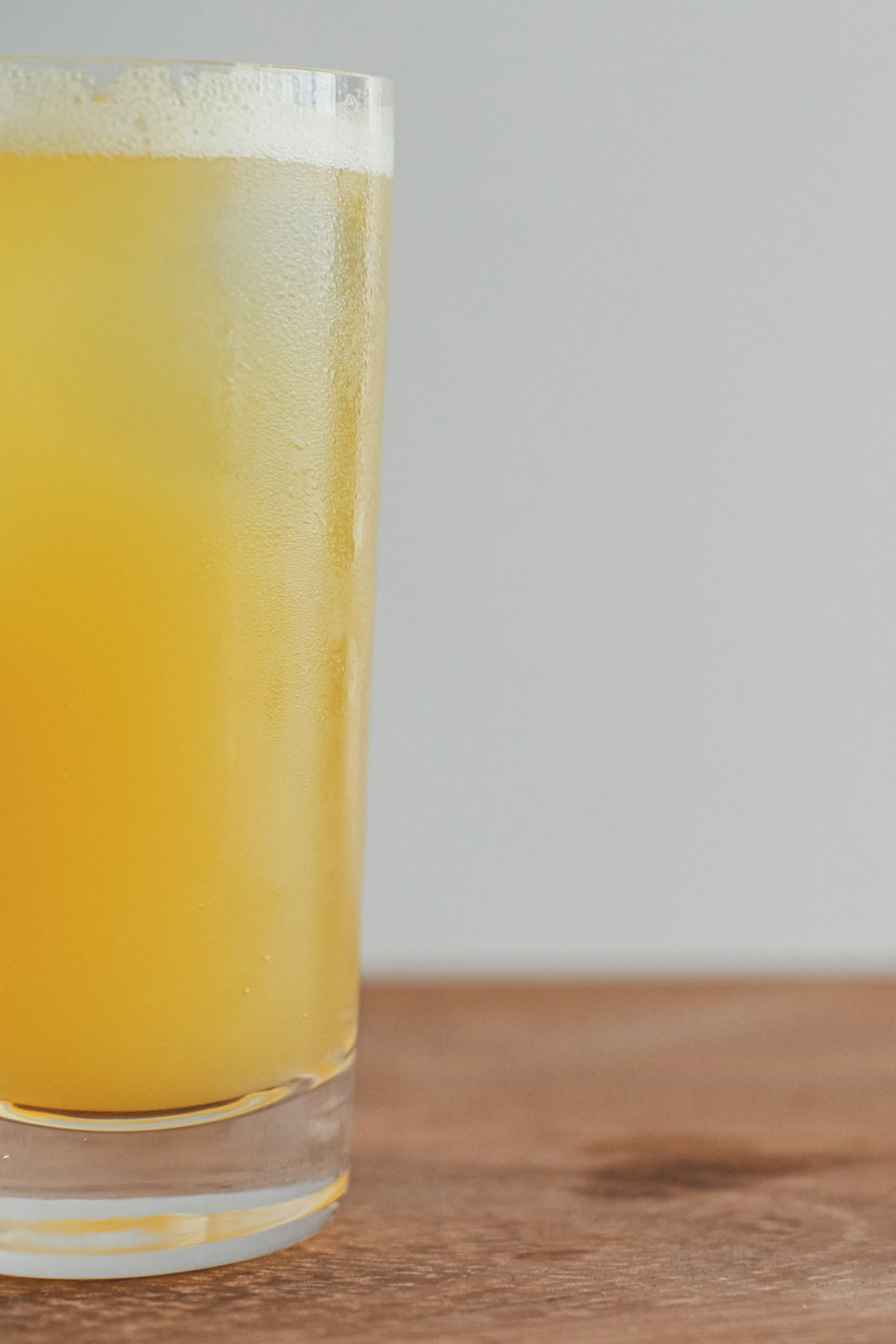 yellow liquid in clear drinking glass