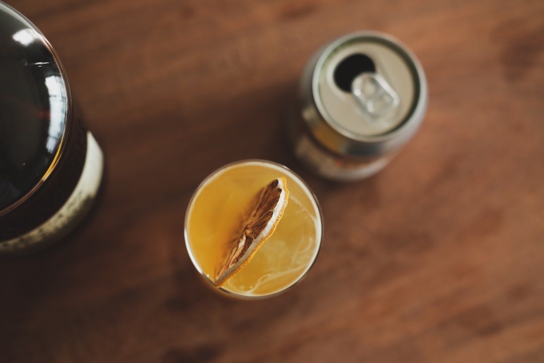 orange juice in clear drinking glass