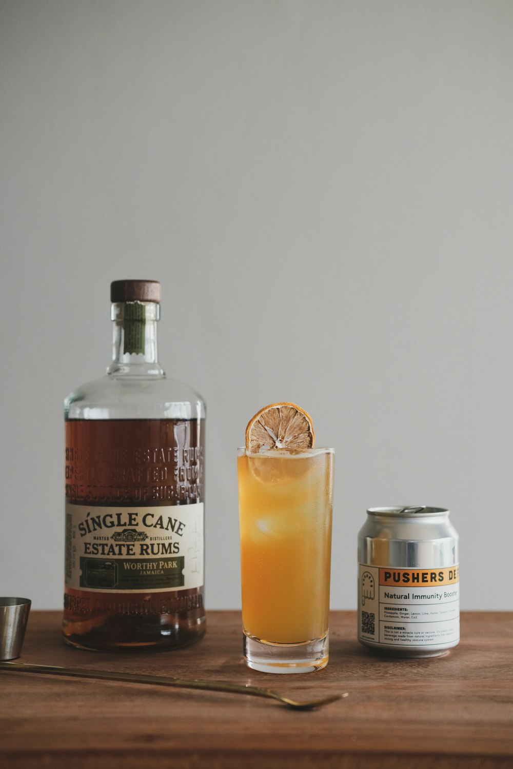 clear glass bottle beside clear drinking glass