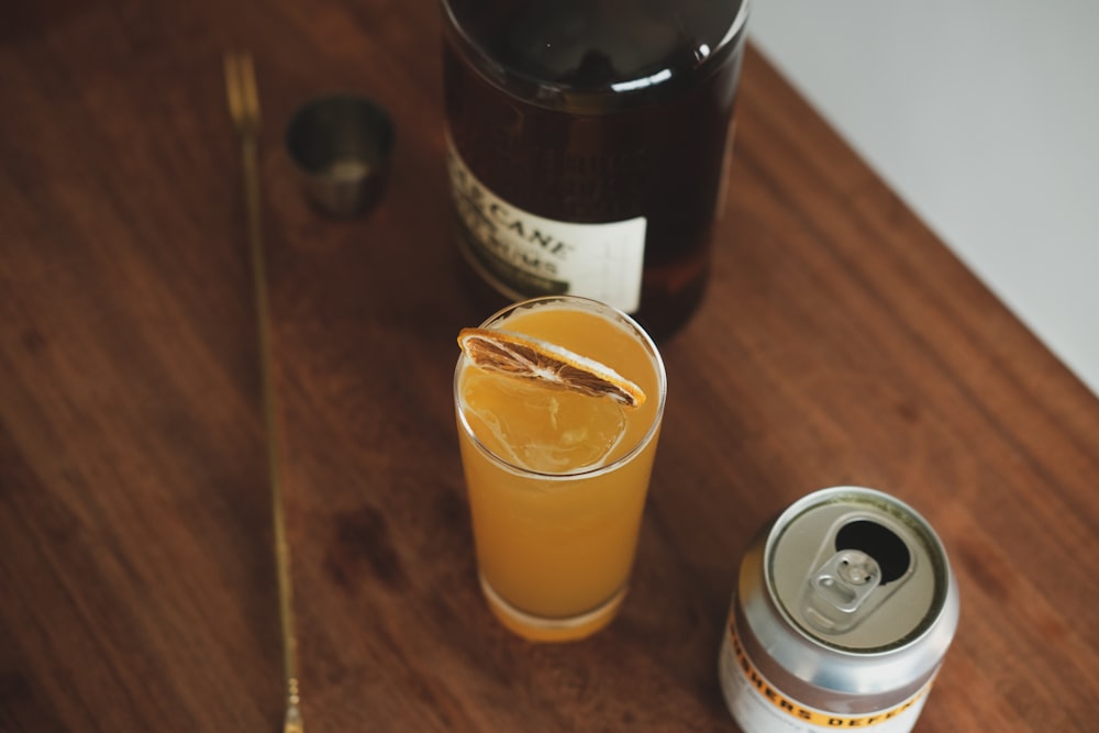 orange juice in clear drinking glass