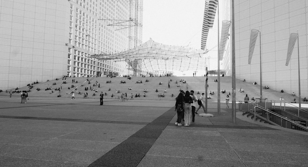 grayscale photo of people walking on street