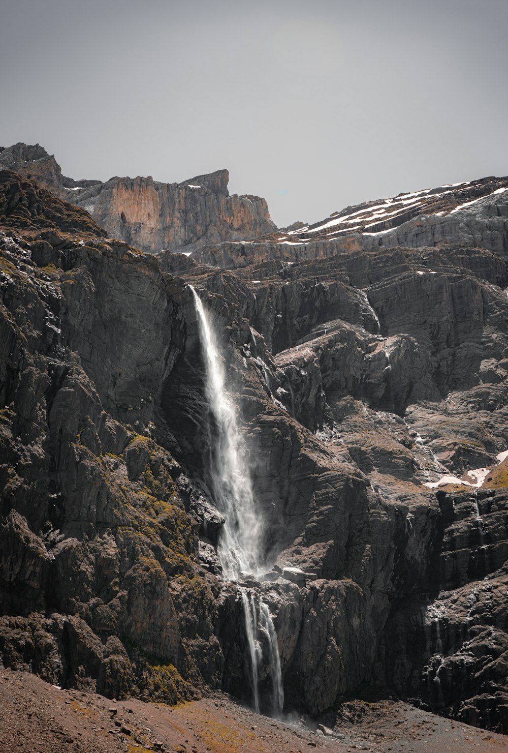 waterfalls on rocky mountain during daytime