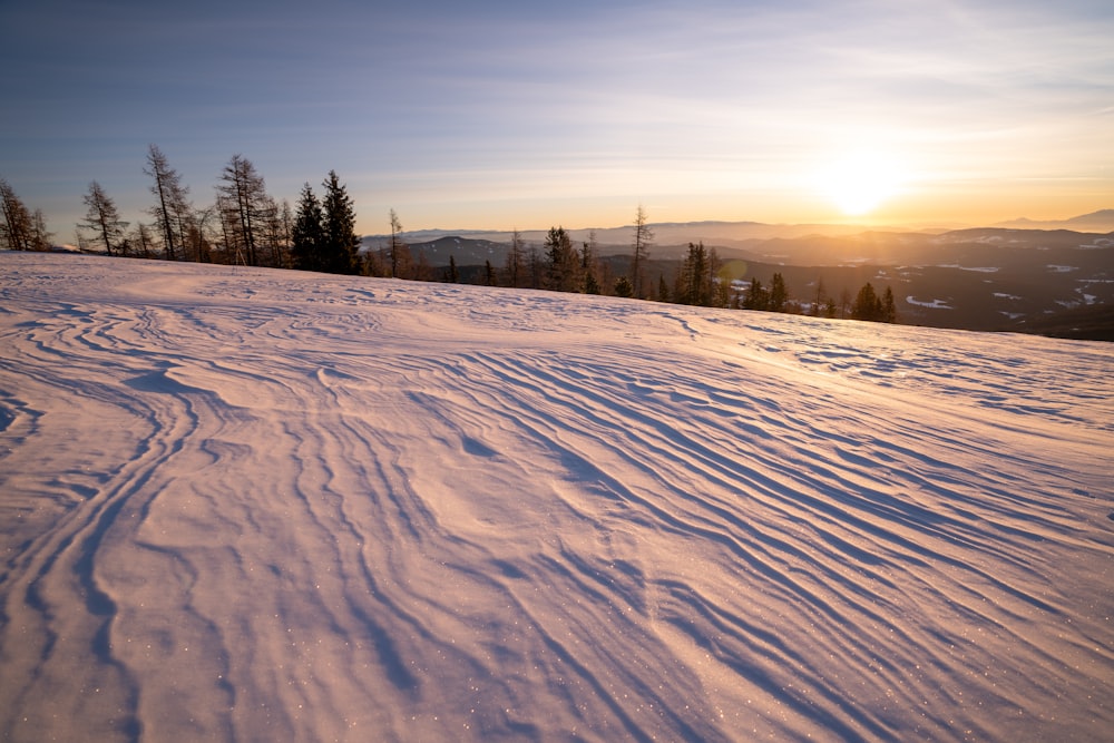 snow covered field during daytime