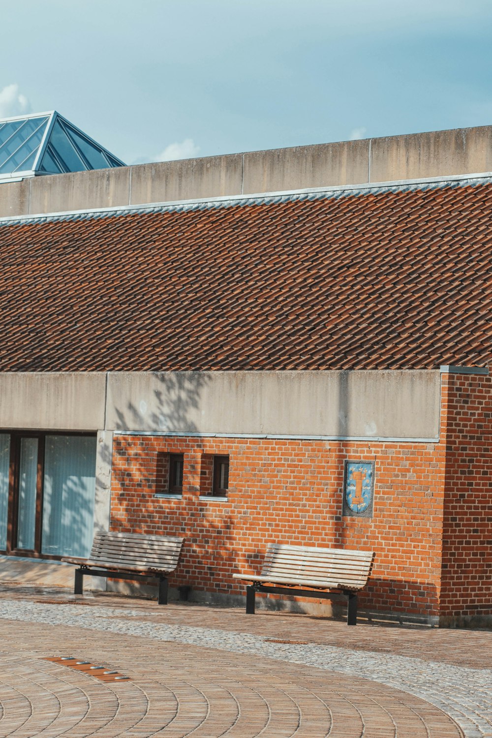 brown brick building under blue sky during daytime