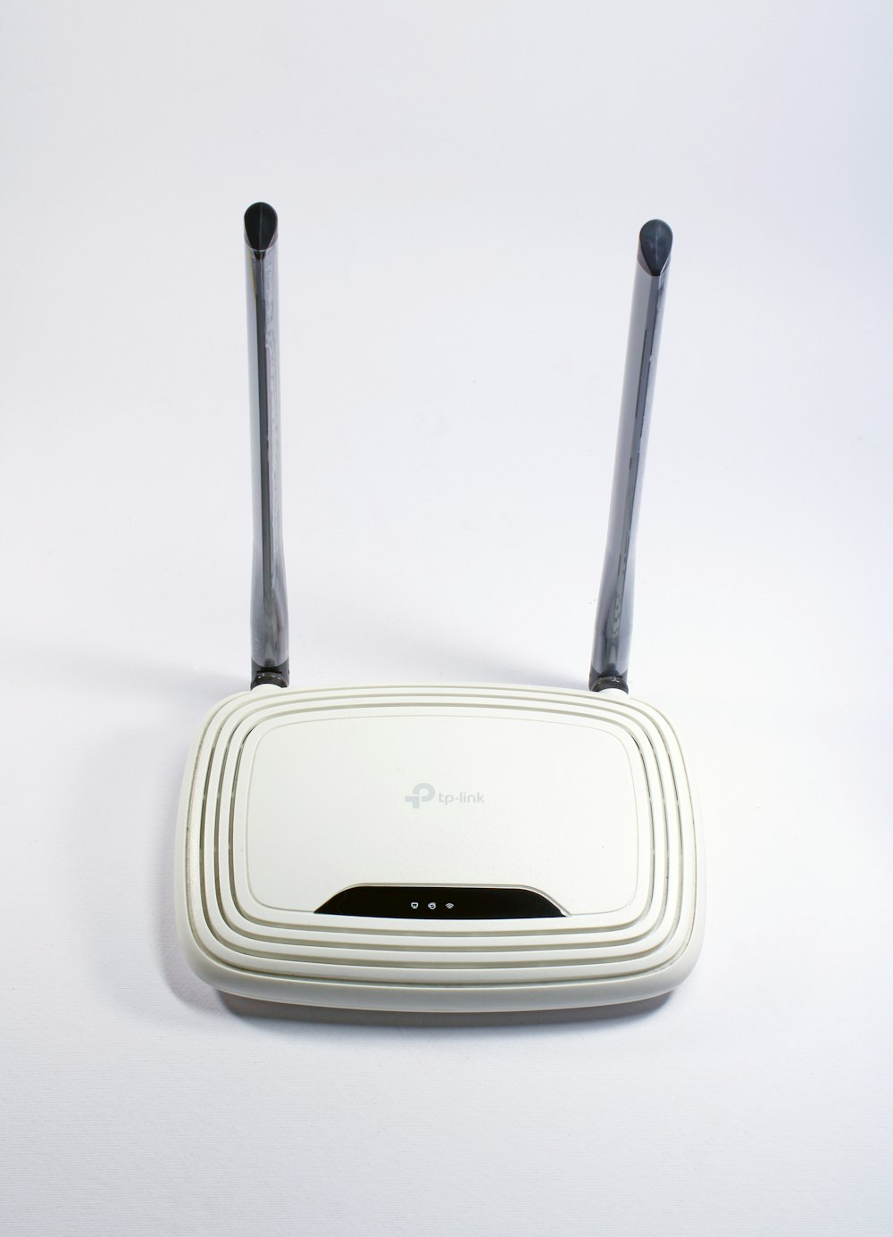 white and black tp link wireless router