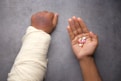 person holding babys hand