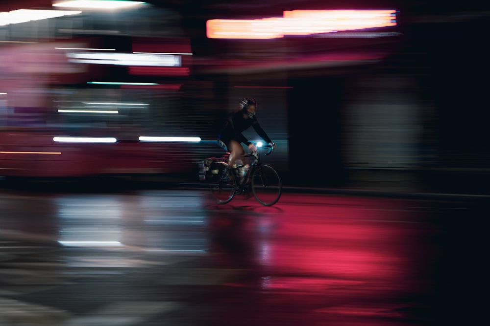 man in black t-shirt riding bicycle