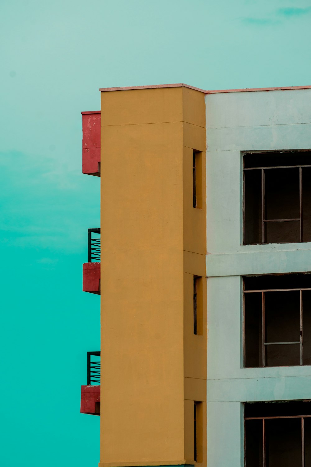 brown concrete building under blue sky during daytime