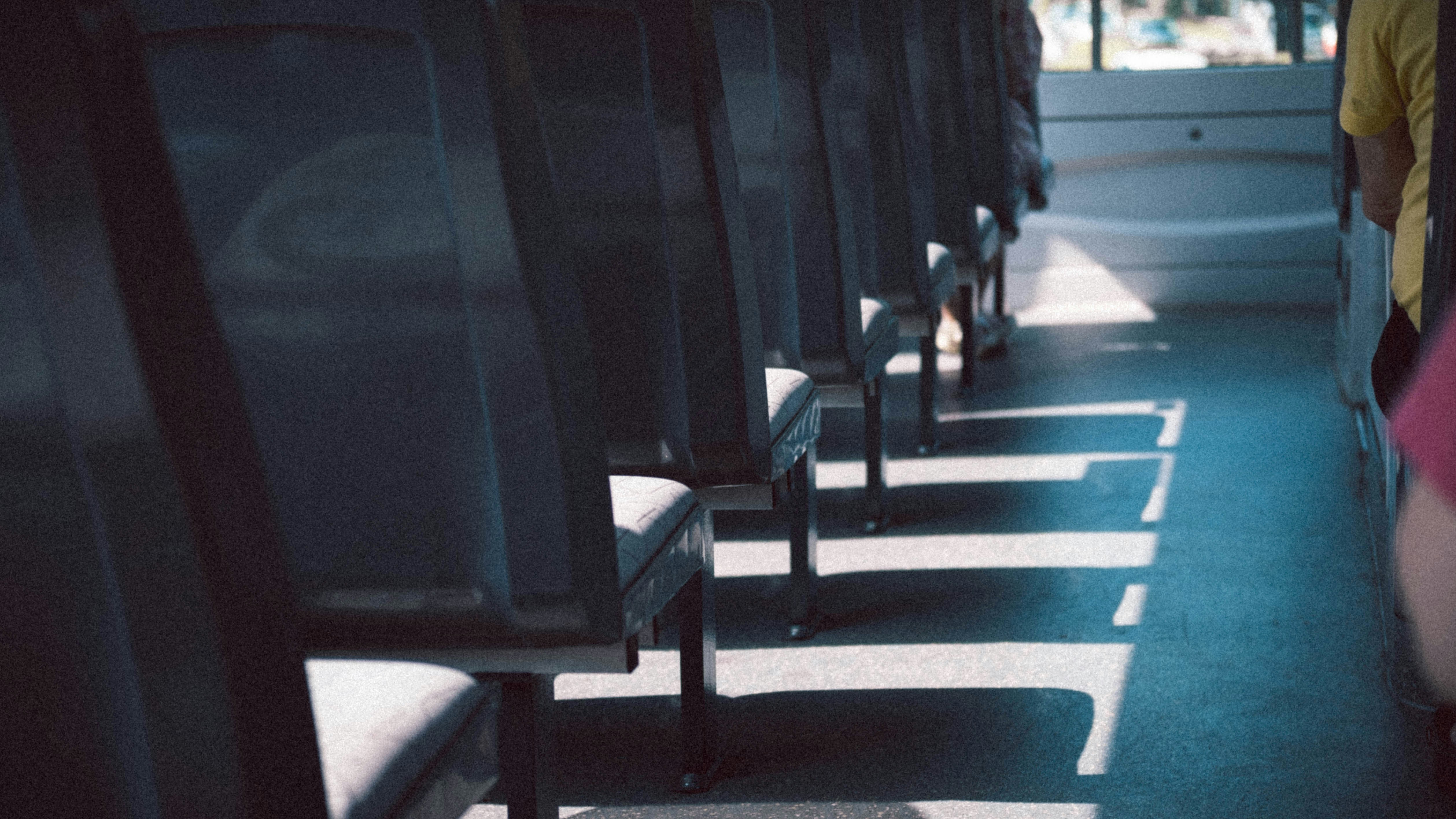 black wooden chair on blue and white stripe floor