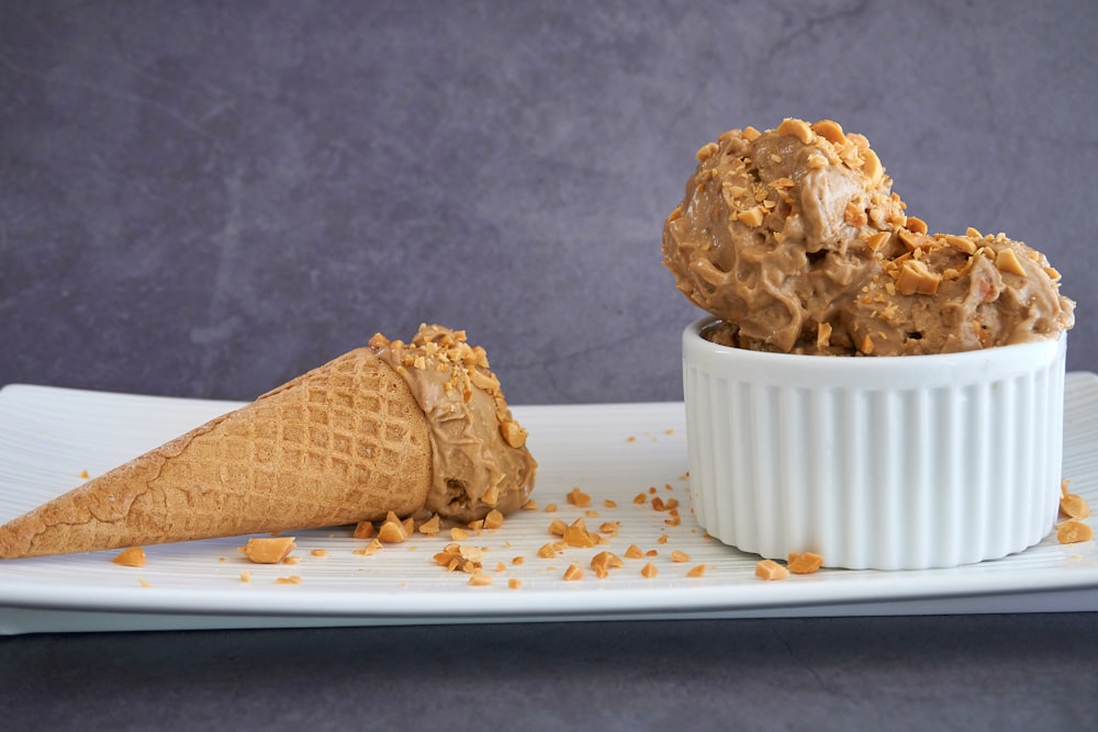 brown ice cream cone on white ceramic plate