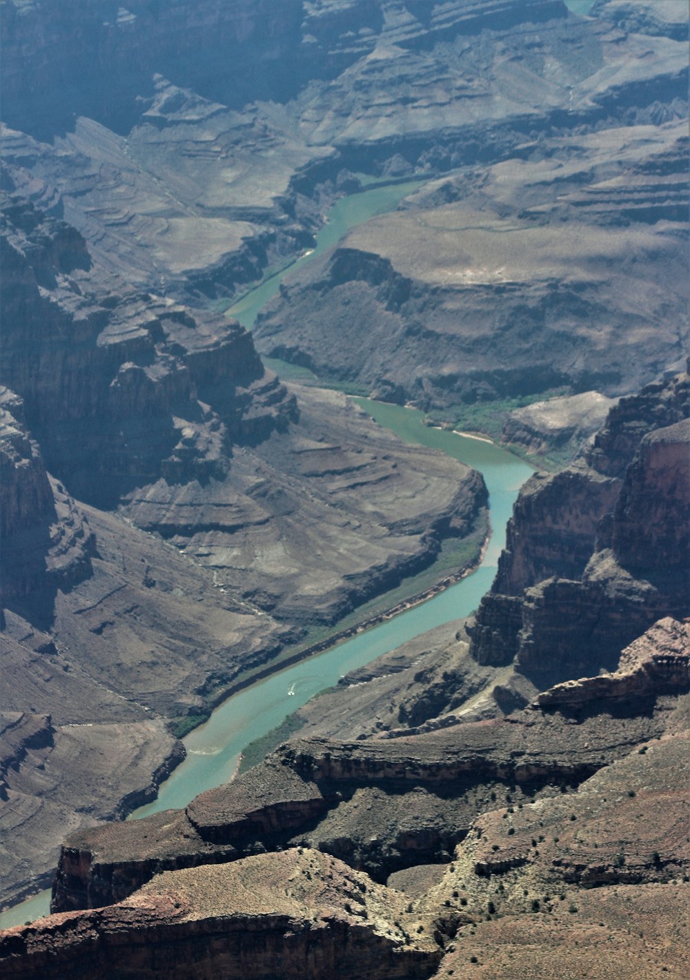 aerial view of river between mountains during daytime