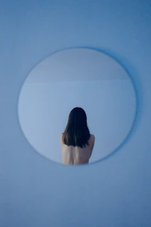 woman in looking at the mirror under stress