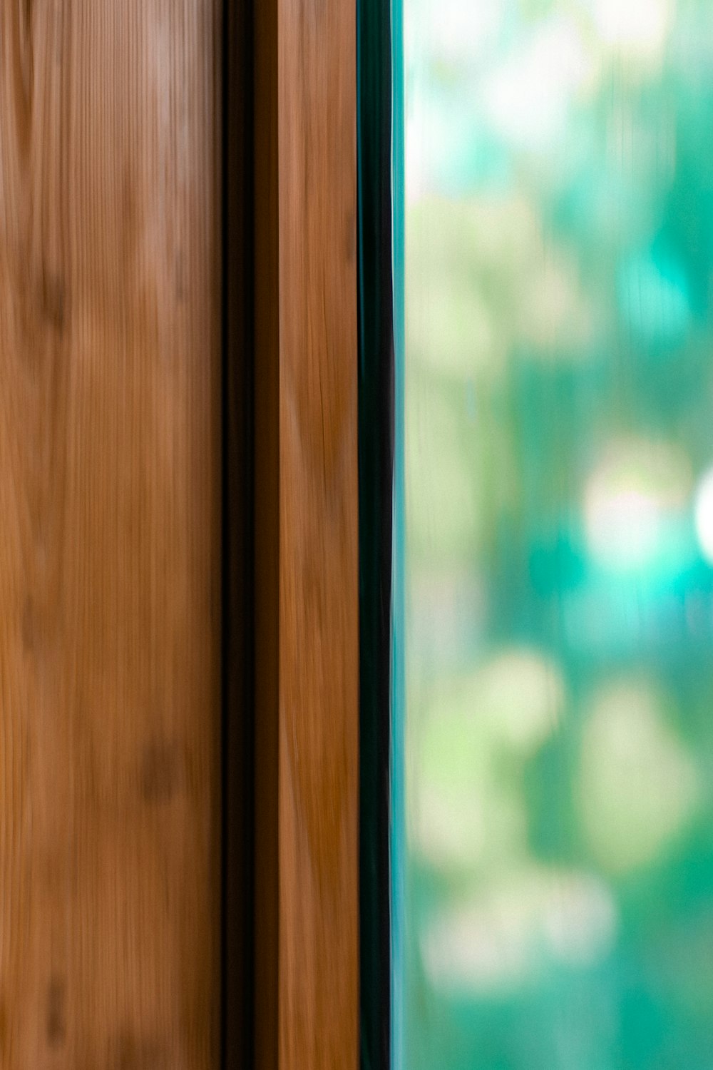 brown wooden framed glass window