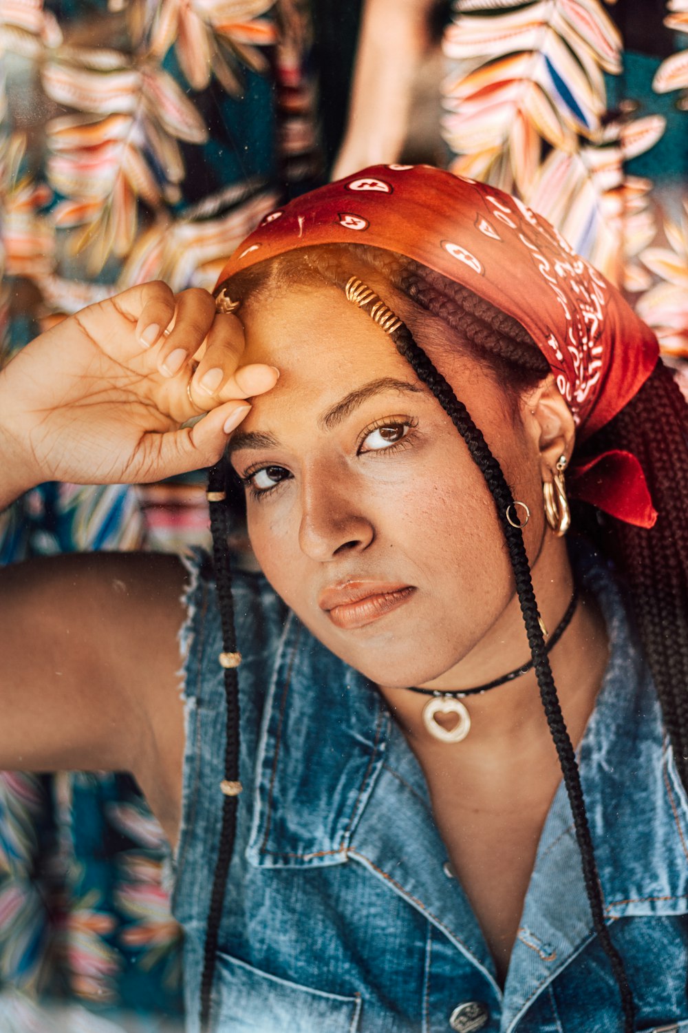 woman in blue denim jacket wearing red headband