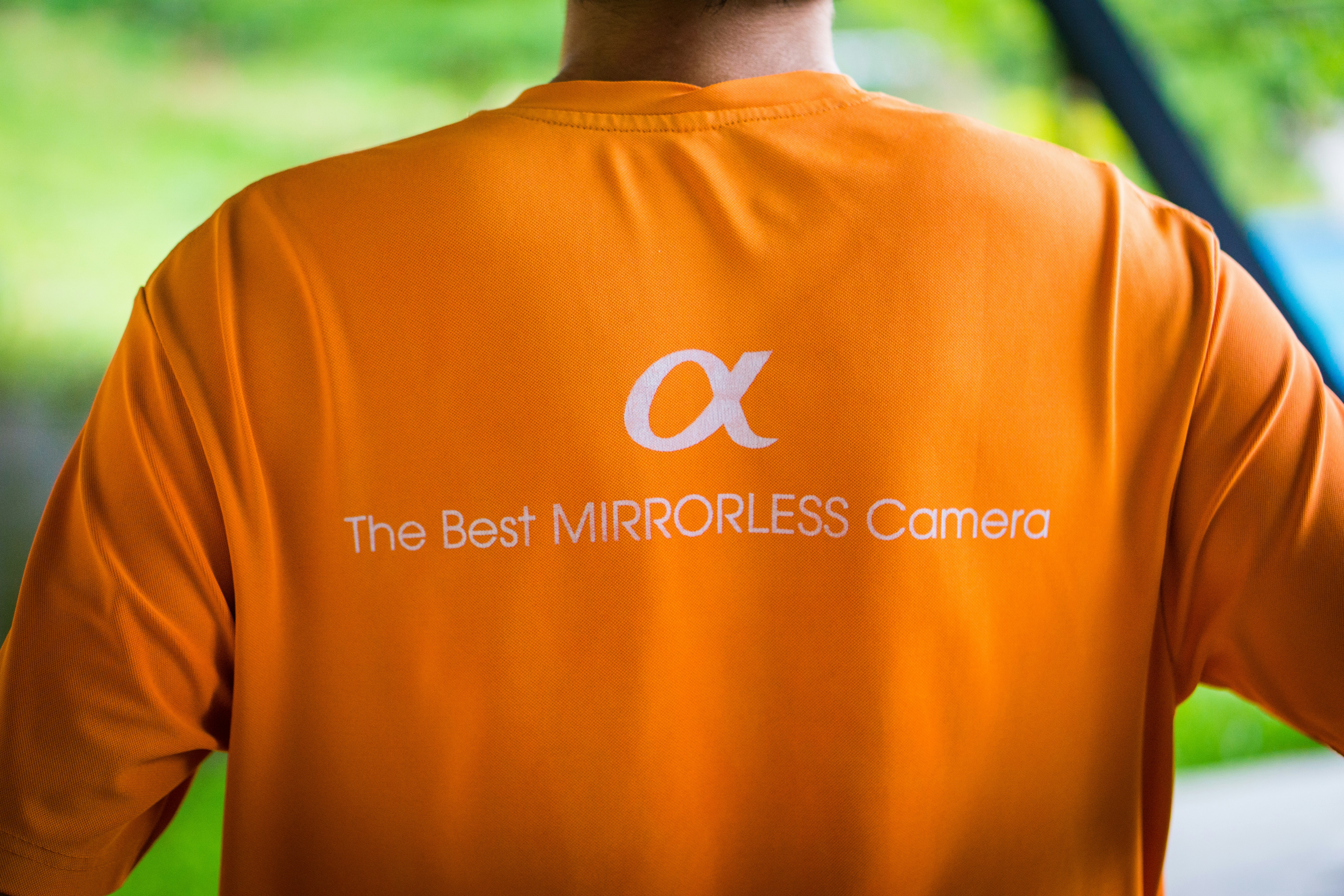 man in orange crew neck t-shirt