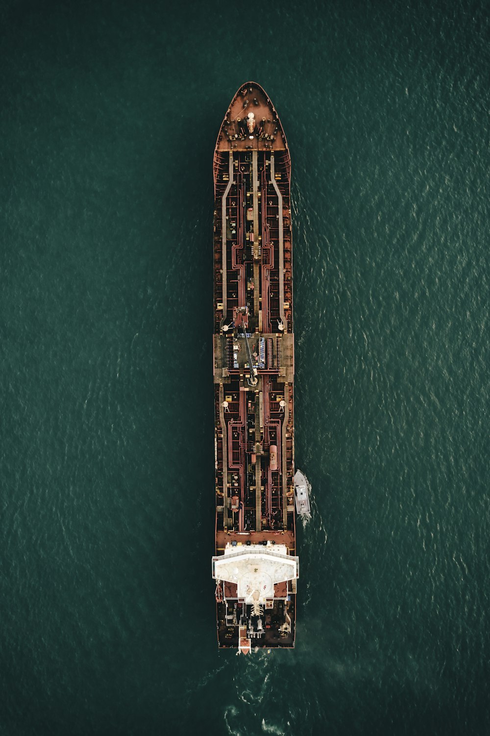 aerial view of brown and white building on body of water during daytime