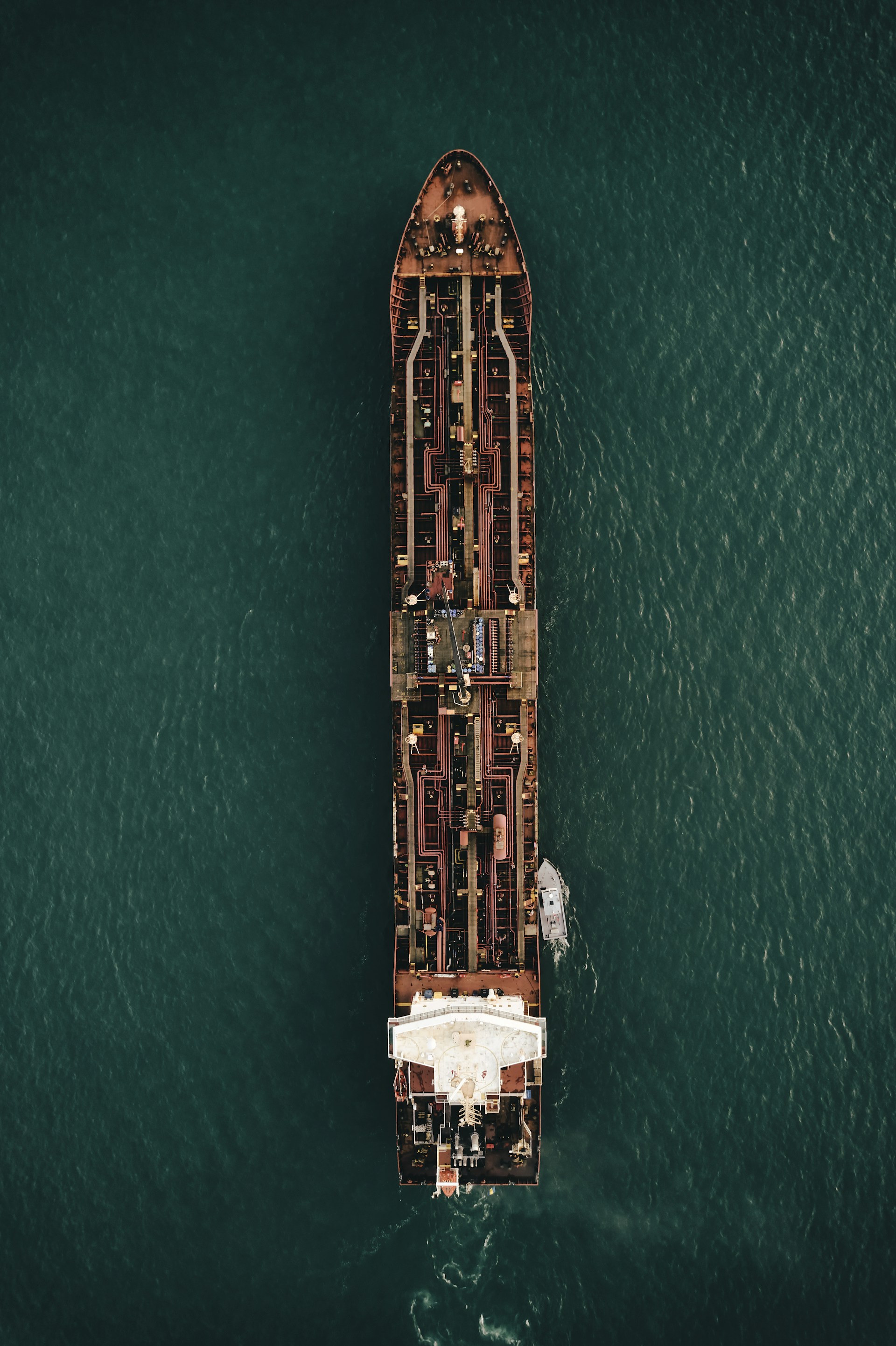 aerial view of brown and white building on body of water during daytime