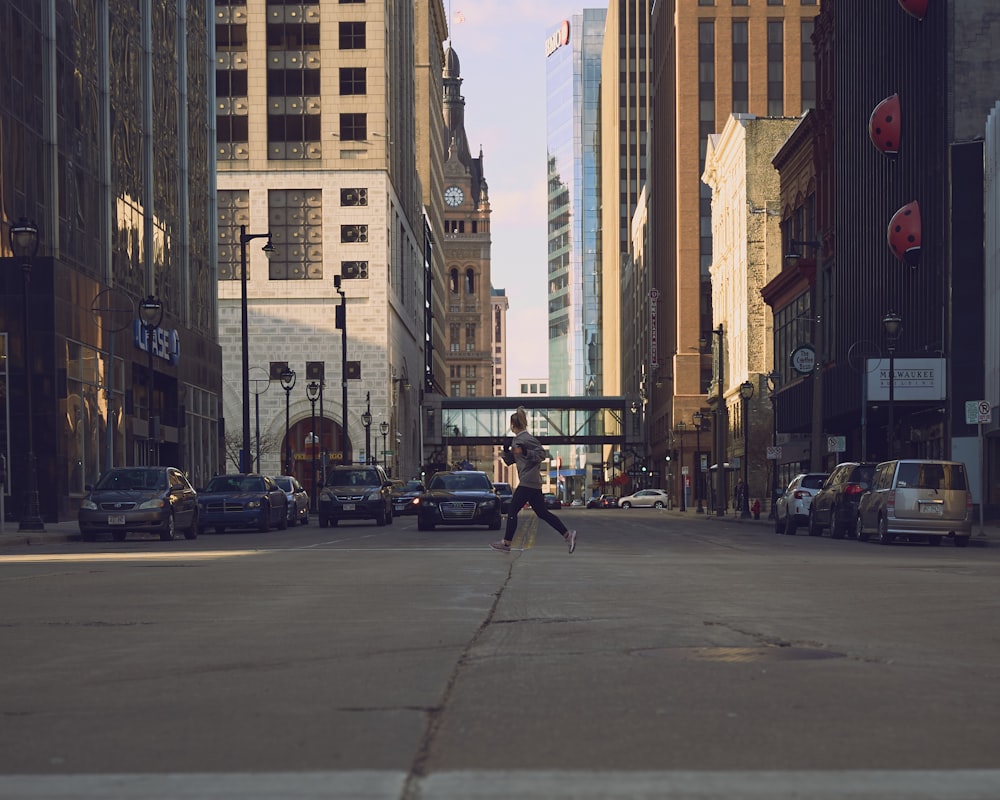 people walking on sidewalk near high rise buildings during daytime