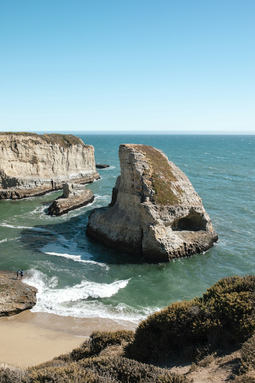 brown rock formation on sea during daytime