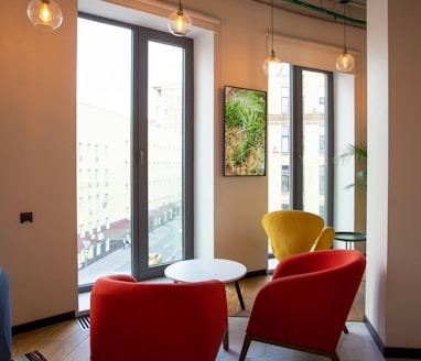 red and black chair near glass door