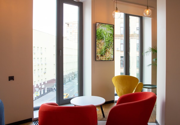 red and black chair near glass door