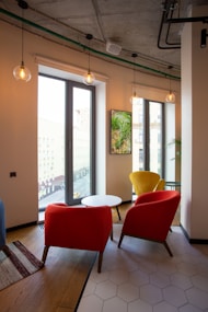 red and black chair near glass door